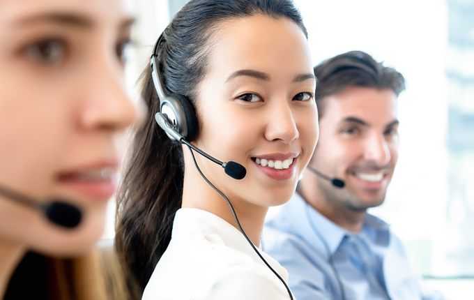 A woman wearing a headset.