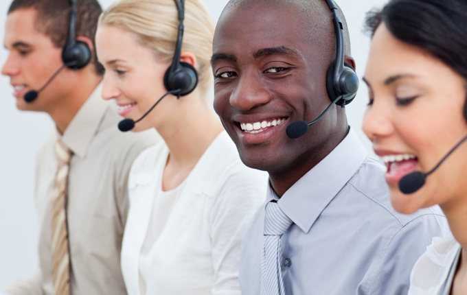 A group of professionals wearing headsets.